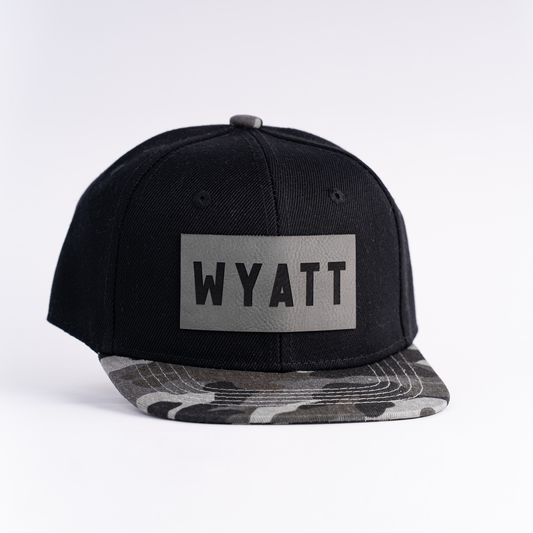 WYATT (Leather Custom Name Patch) - Kids Trucker Hat (Black/Charcoal Camo)