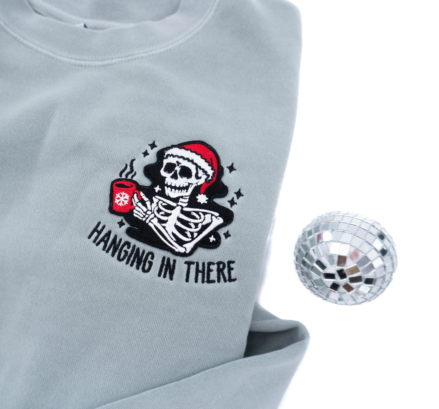 Hanging In There Christmas Skeleton - Embroidered Sweatshirt (Sea Salt)