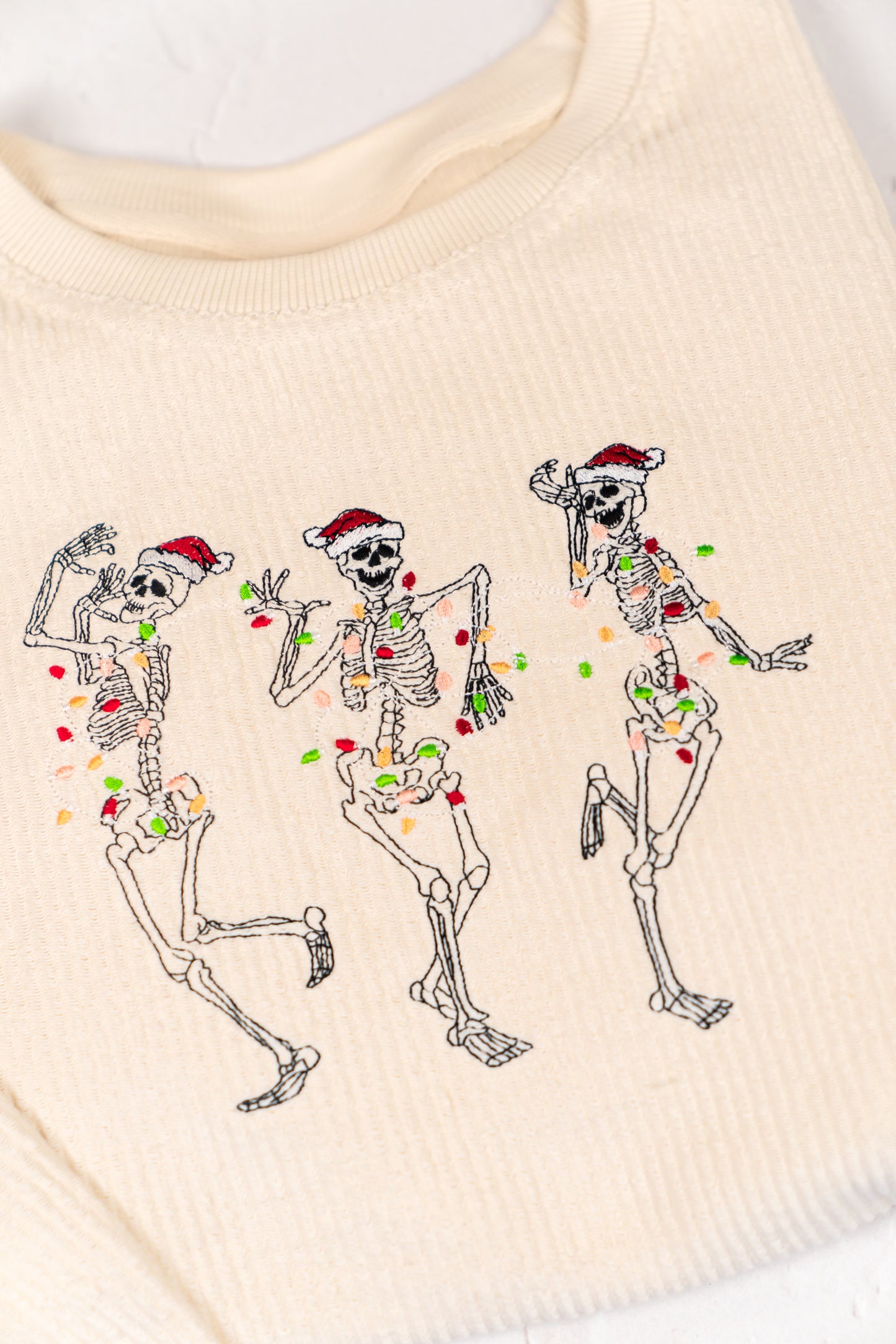 Christmas Dancing Skeleton - Embroidered Corded Sweatshirt (Ivory)