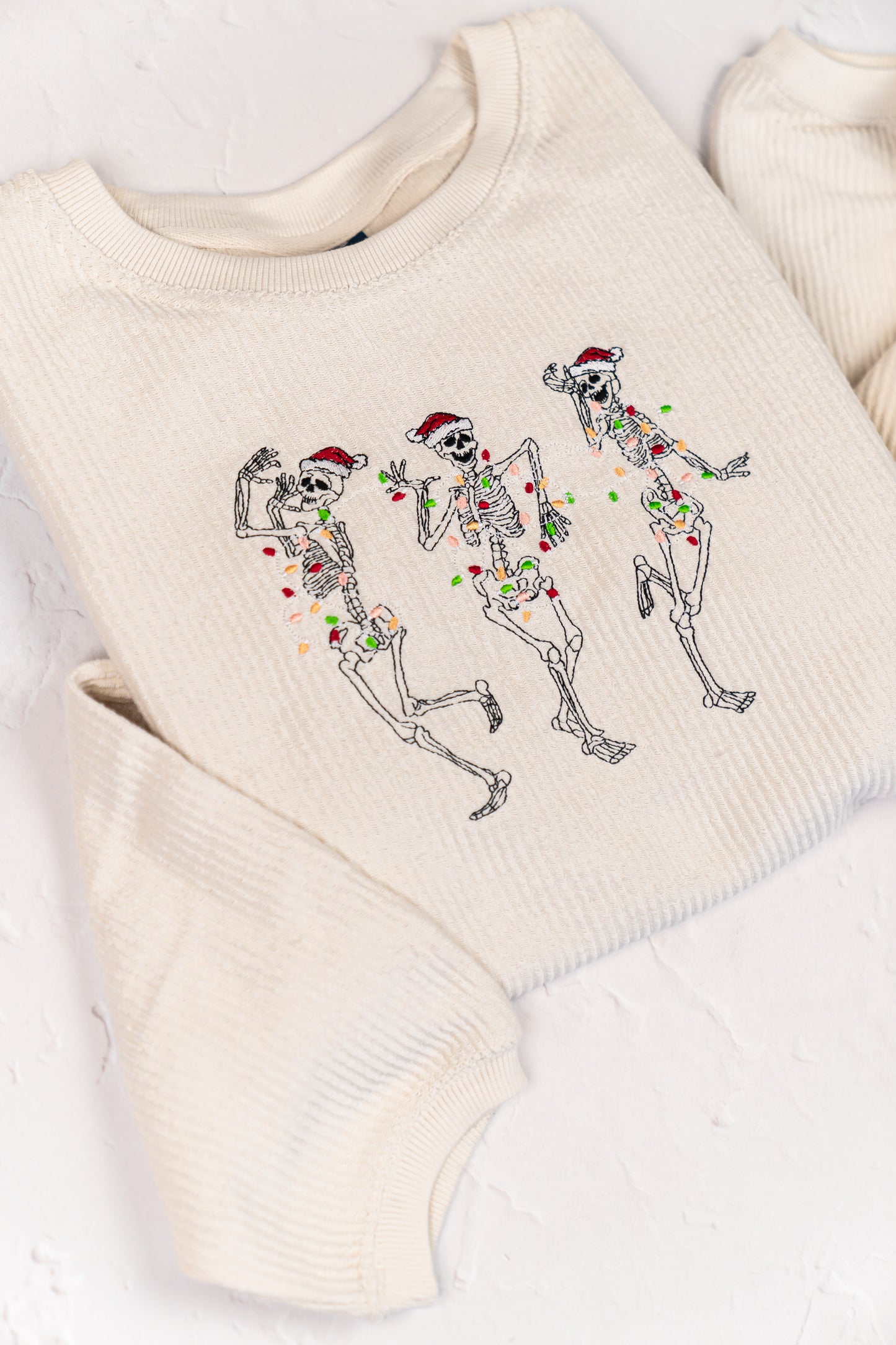 Christmas Dancing Skeleton - Embroidered Corded Sweatshirt (Ivory)
