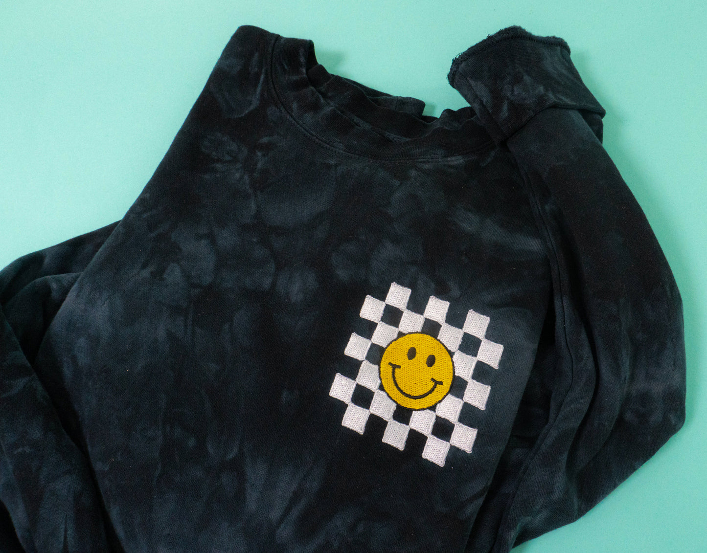 Old School Checkered Smiley - Embroidered Sweatshirt (Black Tie Dye)
