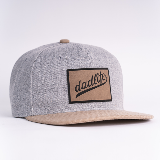 Dadlife (Leather Patch) - Flatbill Trucker Hat (Heather Light Gray/Khaki)